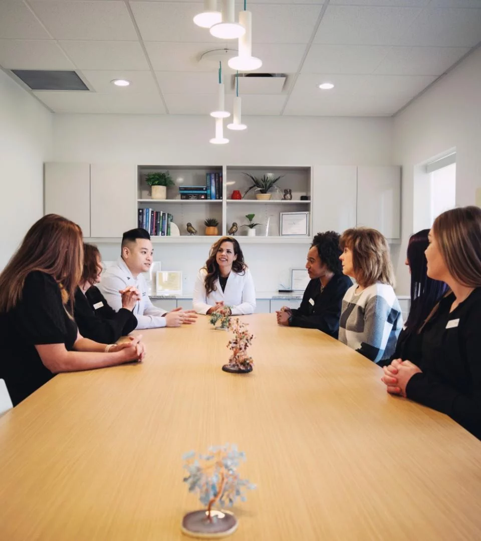 Dental practice owners meeting with a business consultant